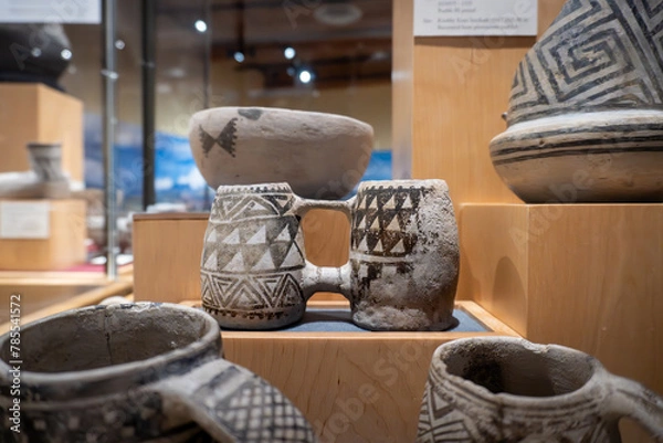 Fototapeta Ancient Puebloan pottery. Double Mug Mesa Verde Black-on-white ceramic on display at Canyons of the Ancients Visitor Center and Museum. Pueblo III period, Mesa Verde ceramic, Native American art. 