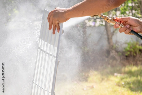 Fototapeta air conditioning filter cleaning with water spray