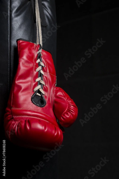 Fototapeta Red boxing glove with low key lighting