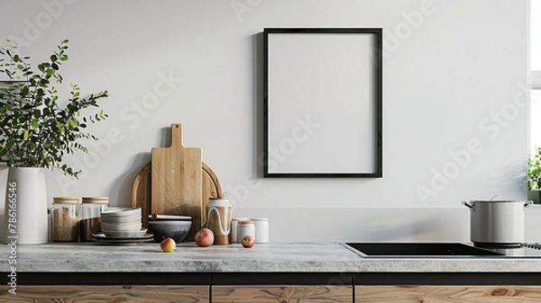 Fototapeta modern farmhouse kitchen with white wall with blank poster frame on the counter