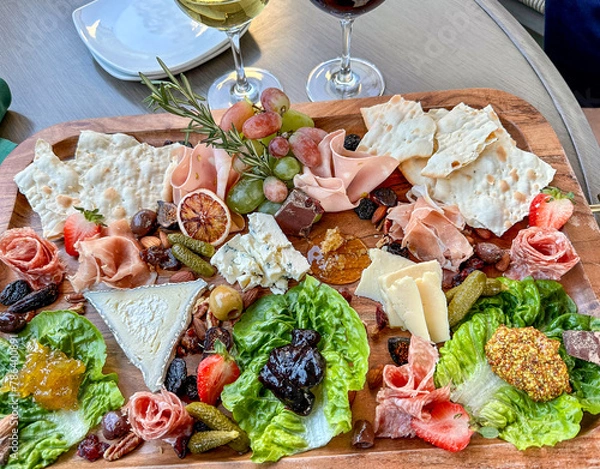 Fototapeta Splendid charcuterie spread with wines