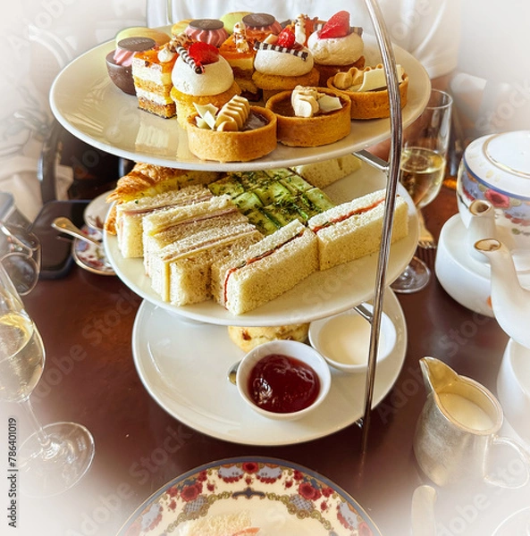 Fototapeta Delectable High Tea assortment on platters