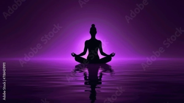 Fototapeta A serene silhouette of a person in meditation pose reflected on water, under a calming purple hue.