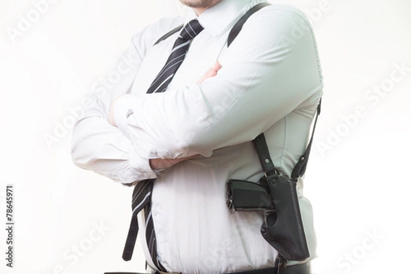 Obraz pistol in a holster under his arm a man on white background