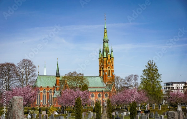 Obraz View of a church at a cemetery