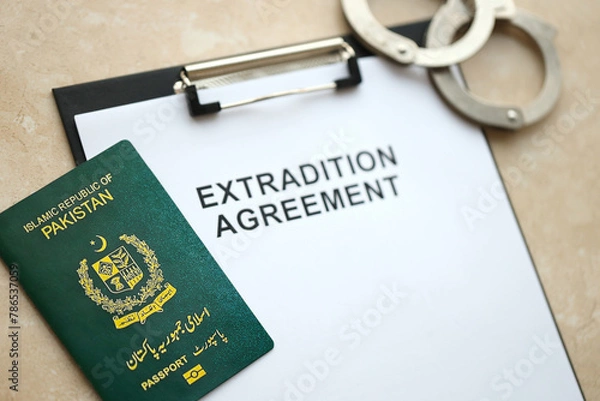 Obraz Passport of Pakistan and Extradition Agreement with handcuffs on table close up