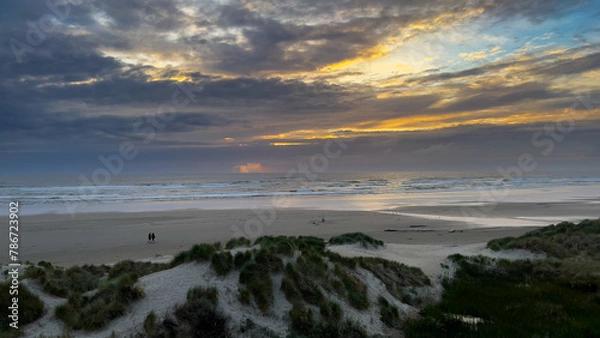 Obraz Sun setting at a beach
