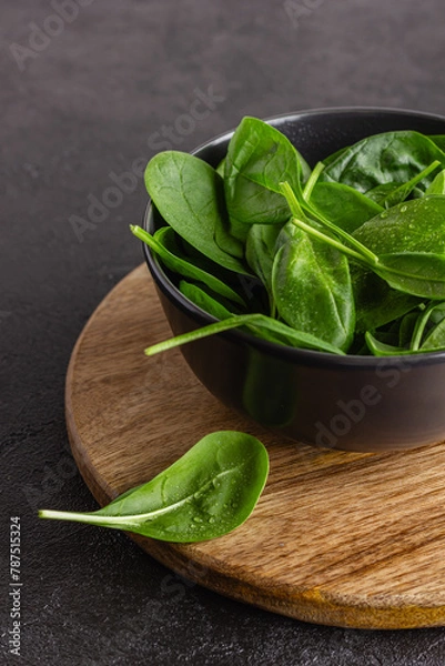 Obraz Fresh green spinach leaves in the bowl. Natural vegetarian food.