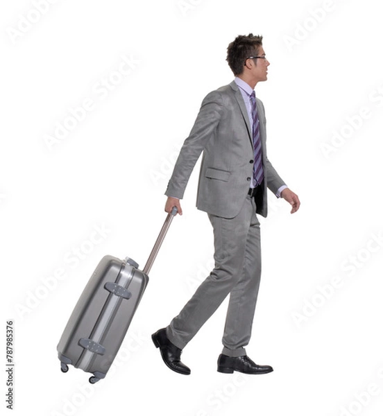 Obraz Traveler businessman walking holding luggage trolley isolated on transparent layered background.