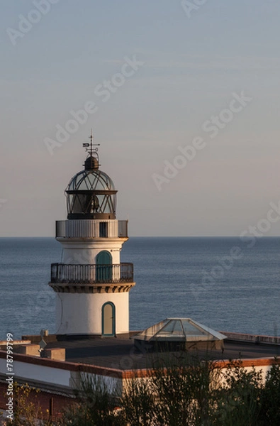 Fototapeta Lighthouse in sunset light.