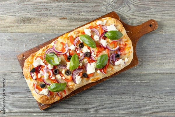 Obraz Traditional Roman pinsa with feta cheese, peppers and black olives.