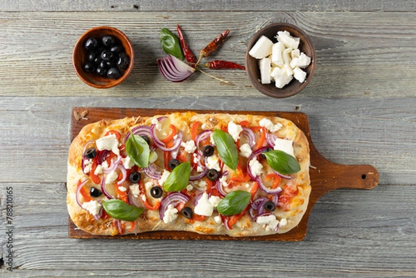 Obraz Traditional Roman pinsa with feta cheese, peppers and black olives.