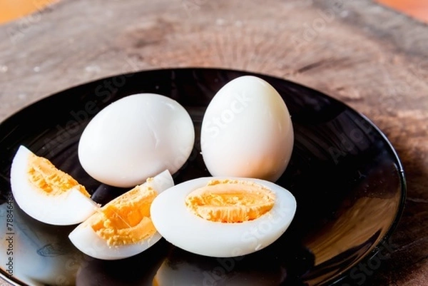 Fototapeta Shell boiled egg  on back plate background