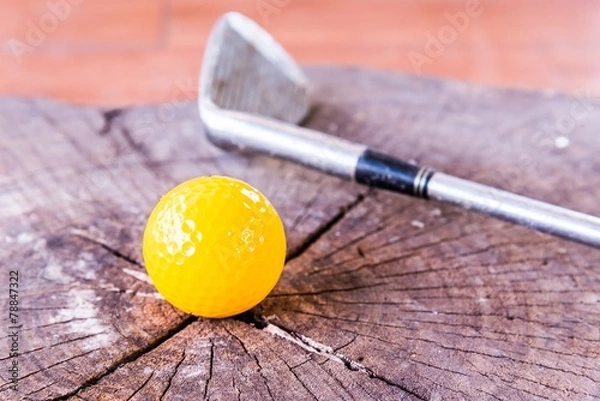 Fototapeta Still life Yellow Miniature Golf Ball On White Background.