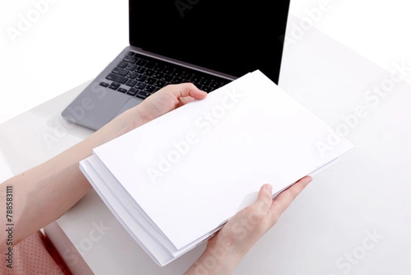Fototapeta woman with a book, magazine and laptop on a white background. student. business. mockup