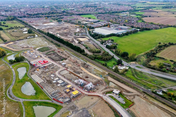 Fototapeta Aerial photo of a construction building site building houses, taken in Leeds in the UK showing a housing development with houses being built.