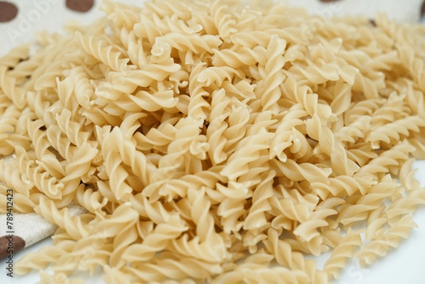 Obraz Close up of raw macaroni pasta isolated on white background.