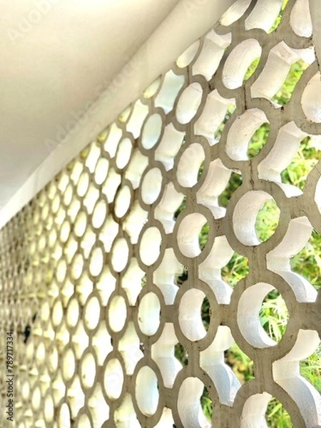 Fototapeta wall with pattern and greenery - travel texture in Cambodia