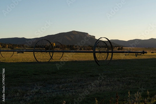 Fototapeta distant mountain across a farm field