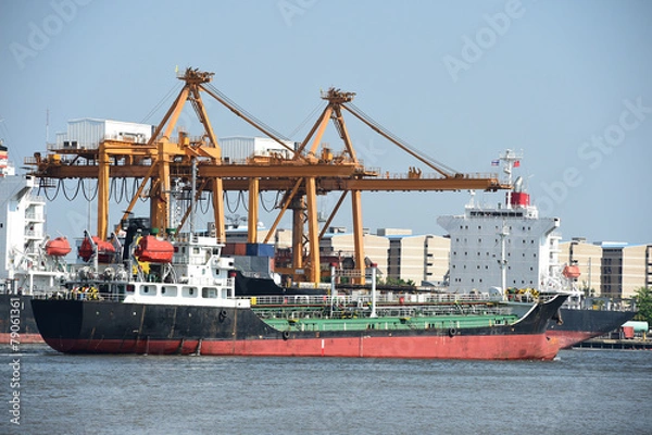 Fototapeta Container cargo freight ship with blue sky