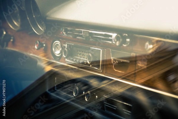 Fototapeta Dashboard retro car interior through window with reflection