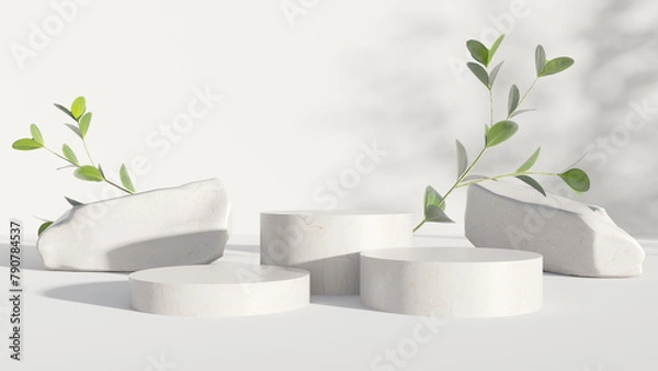 Fototapeta Cylindrical stone product podium with green boxwood branches with sunlight and beautiful shadows on white background. Mock up for product presentation, organic cosmetic and food concept