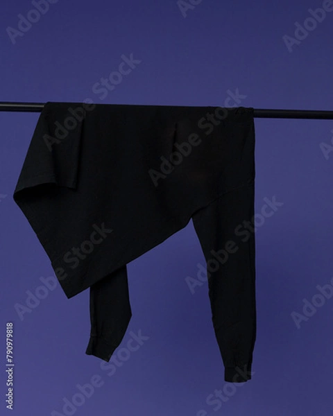 Obraz Longsleeve hangs on a purple BACKGROUND