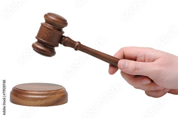 Obraz Hand with gavel on a white background