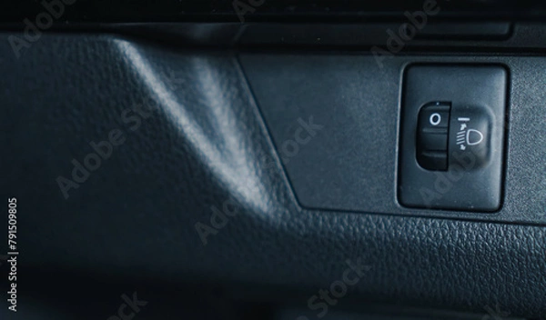 Fototapeta button that adjusts the level of car headlights