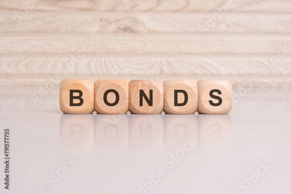 Obraz wooden cubes with letters form the expression BONDS. finance and business concept
