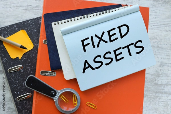 Fototapeta Fixed Asset desktop orange folder calculator. text on a notebook