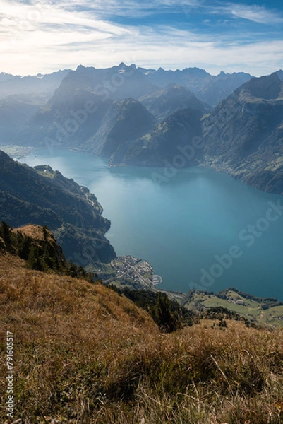 Fototapeta Lake in a valley seen from Fronalpstock summit in Switzerland. Swiss Alps iconic view