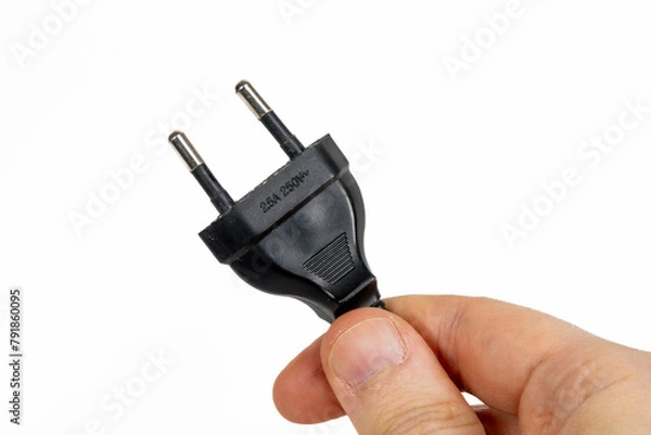 Obraz Electric plug being held in a hand