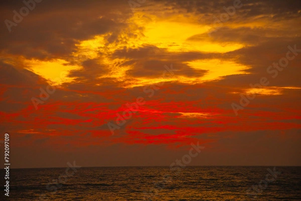 Fototapeta Attractive dramatic red sunset with cloudy sky