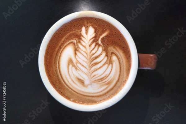 Obraz Top view of a cup of coffee latte on wooden table. 