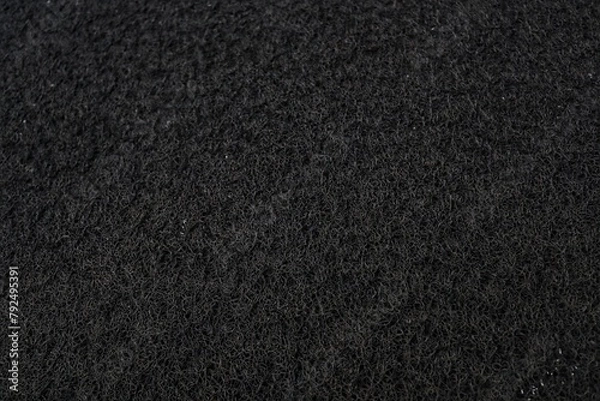 Fototapeta The texture and background of the black doormat.