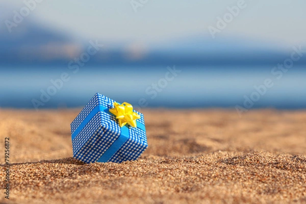 Obraz Blue gift box on a beach