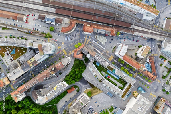Fototapeta Fribourg, Switzerland: Top down view of the Fribourg city center around the train station in Switzerland
