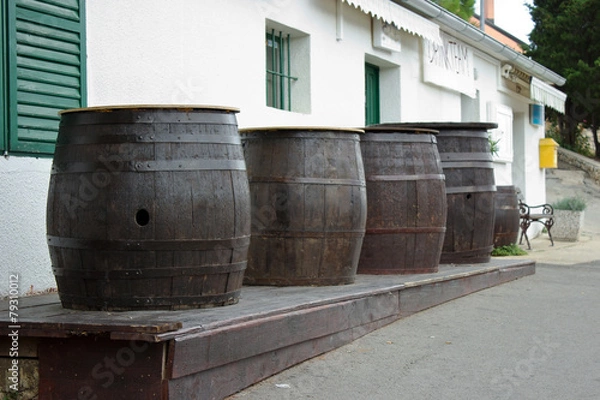 Fototapeta Wooden Barrels In Front Of Pub