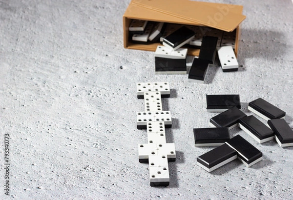 Obraz Dominoes on a neutral background: Concept of business strategy.