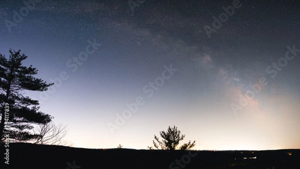 Obraz The Milky Way Galaxy arching over the light dome created by the cities of Leominster and Fitchburg Massachusetts. The Milky Way is visible from the galactic core all the way to the Cygnus Region.