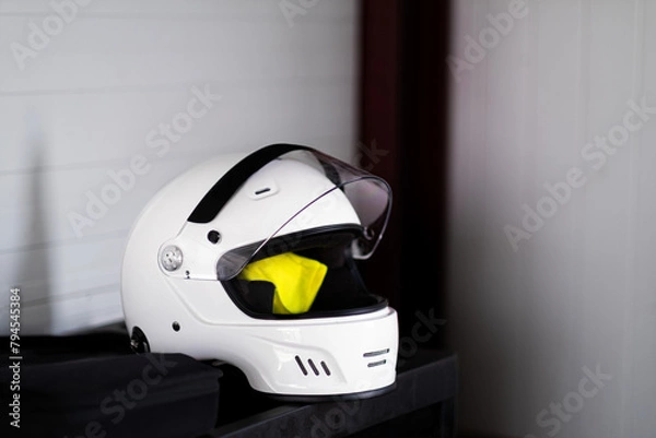 Obraz Competitor's white helmet and reflective vest, protective attire, ready for Castilla y León racing.
