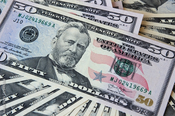 Obraz Dollar notes in denominations of $ 50, lying face.
