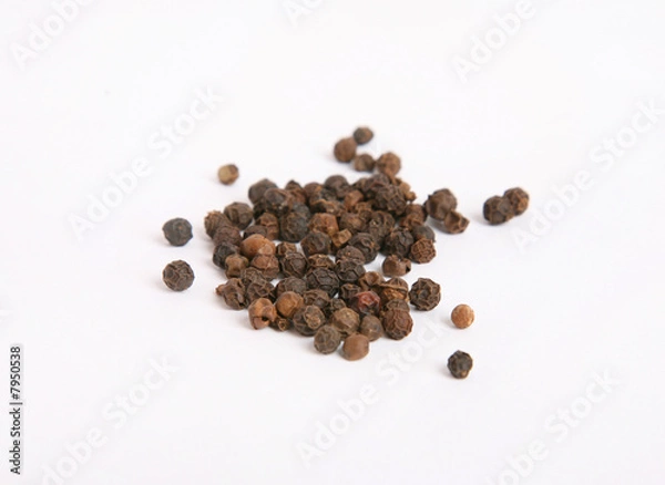 Fototapeta Black pepper in close-up isolated on white background