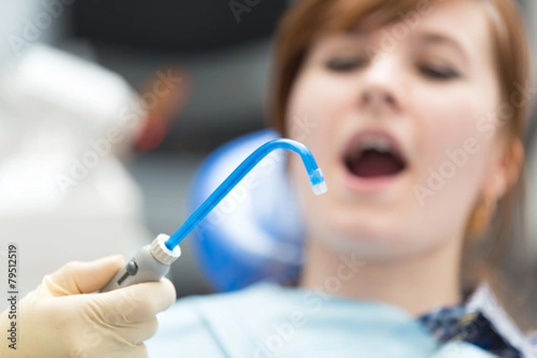 Obraz saliva ejector on background woman