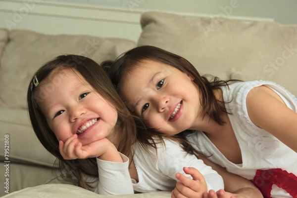 Obraz Smiling asian toddler sisters