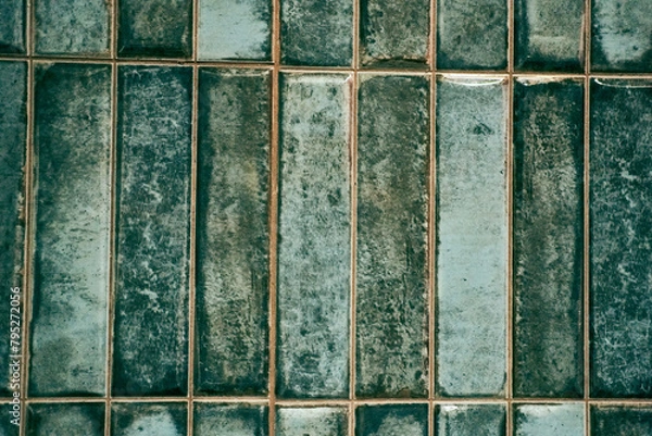 Fototapeta A pattern of modern vertical rectangular malachite tiles. Realistic texture. The walls are lined with green ceramic tiles with space for copying. High quality photo