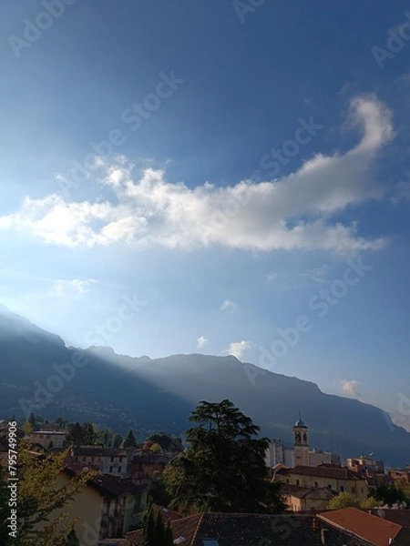 Fototapeta clouds over the city