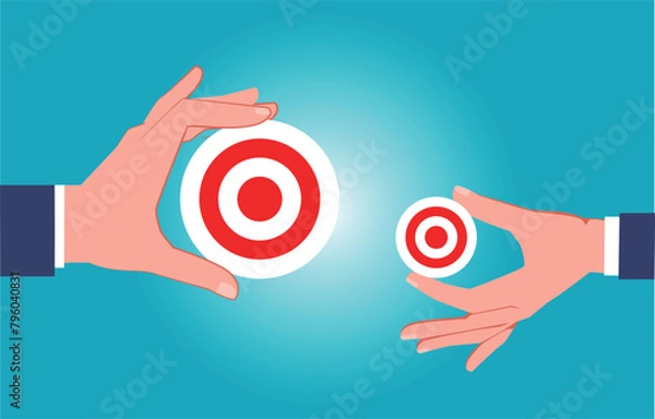 Fototapeta Big target vs. small target, task or goal, one hand holding a big target and the other hand holding a small target