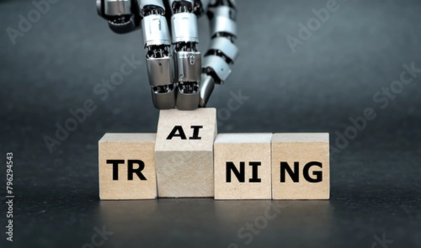 Fototapeta Robot Hand turns wooden cube and puts the letters AI (artificial intelligence) to the word training.